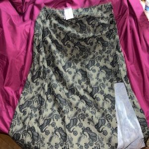 Green skirt with black design small skirt underneath